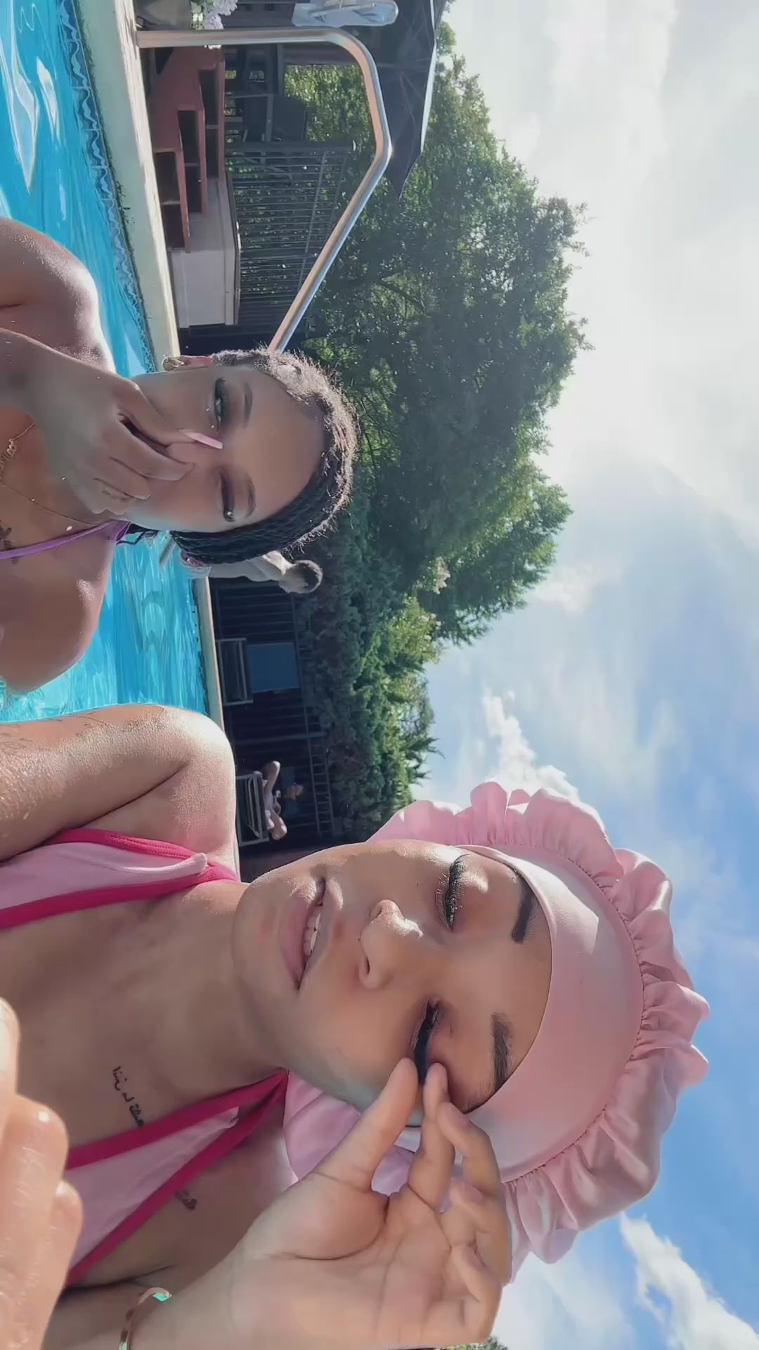 Load video: Girl is demonstrating the effectiveness of lash glue by pouring water on her cluster lash set, and tugging at the clusters repeatedly